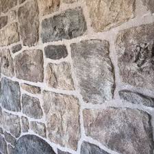 Natural stone wall with hand-pointed joints